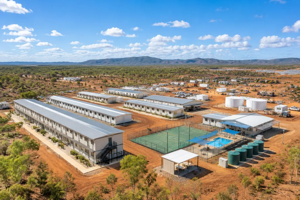 Aerial view of a remote mining accommodation village with rows of donga units