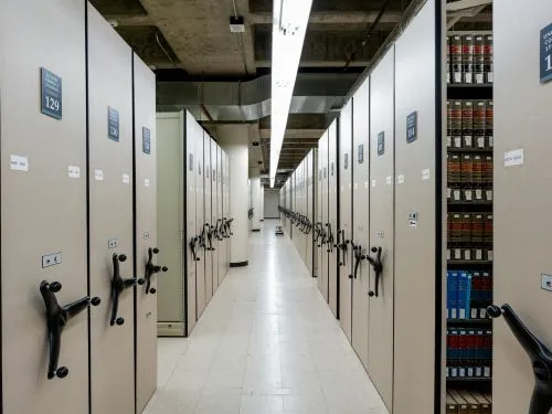 Archive room with rows of mobile compact shelving