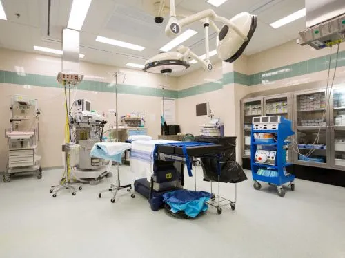 Hospital operating theatre with surgical lights and equipment